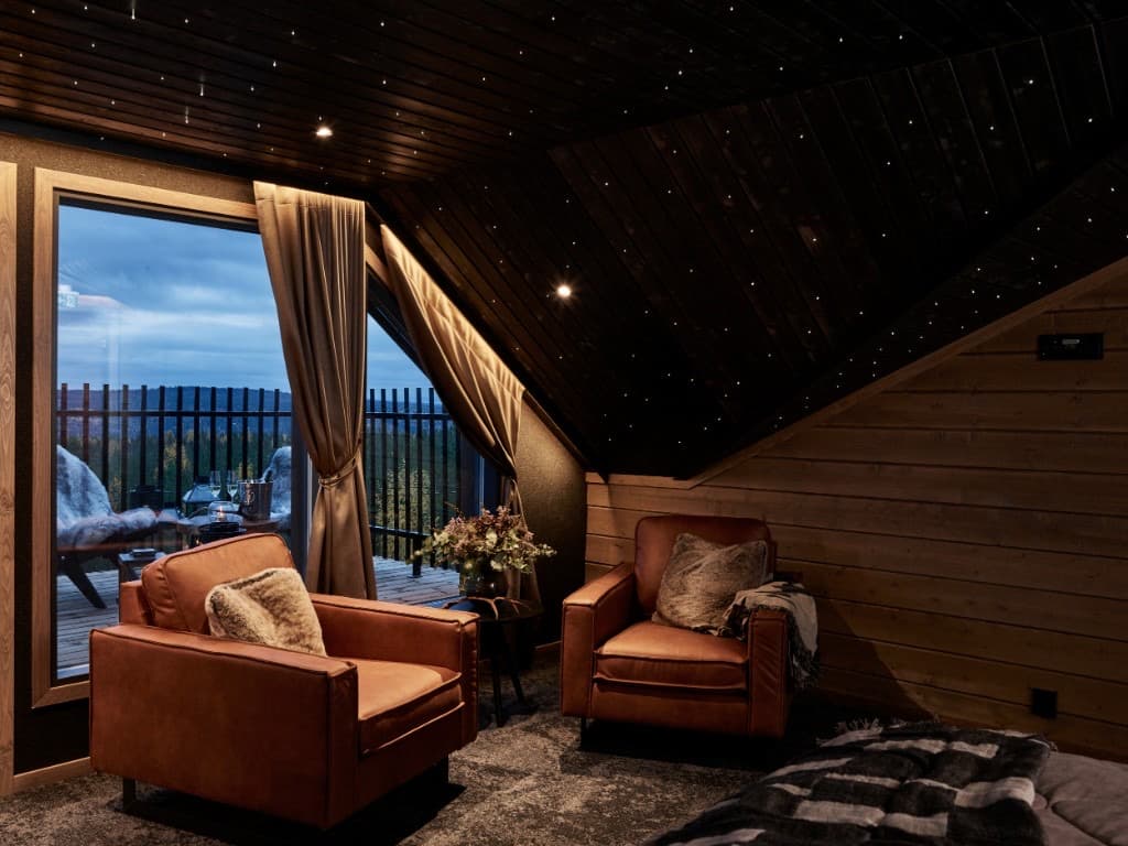 Master suite under a starlit ceiling with fell views